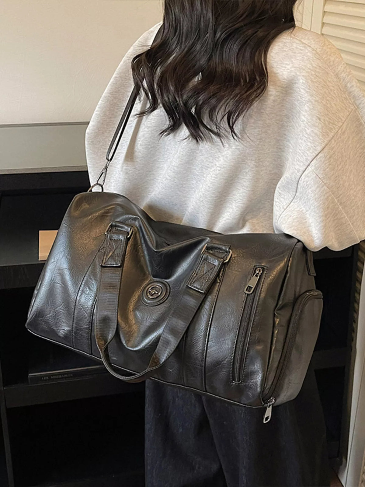 Black leather duffel bag interior view