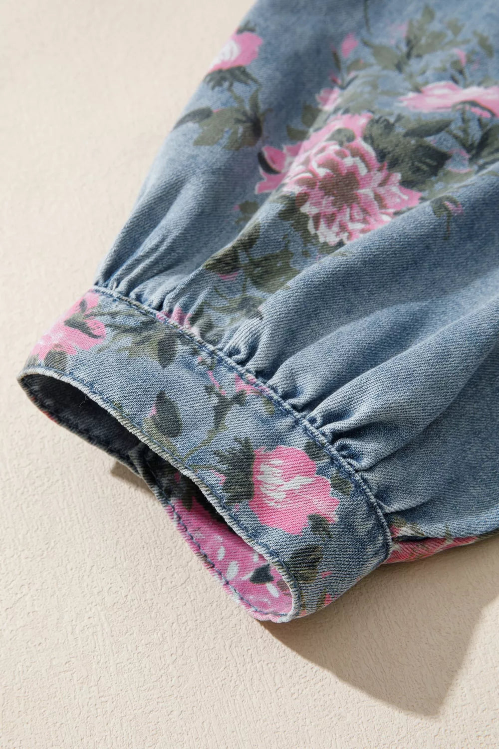 Collar and cuff detail on the floral denim shirt