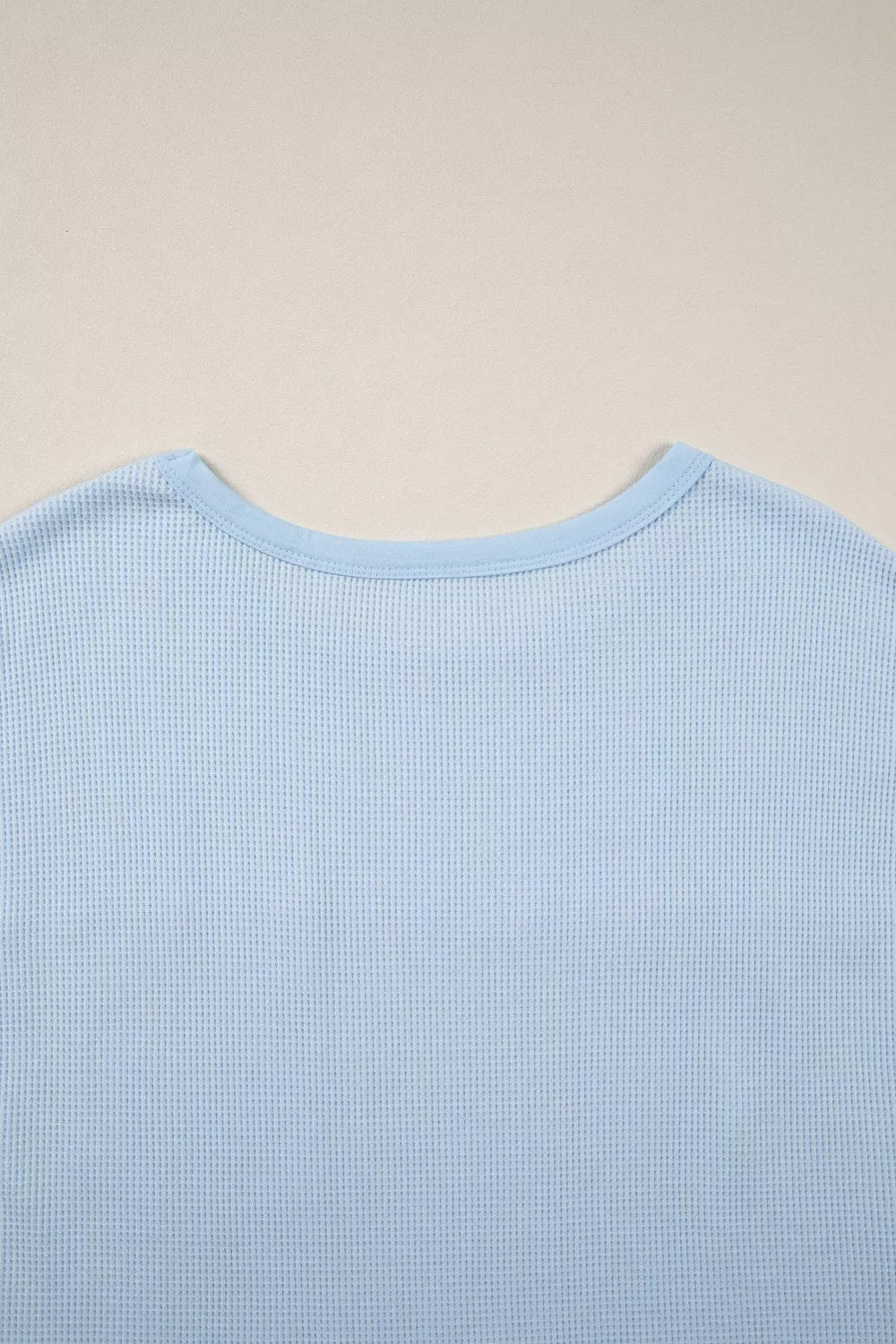 Light blue waffle knit pocket tee side view