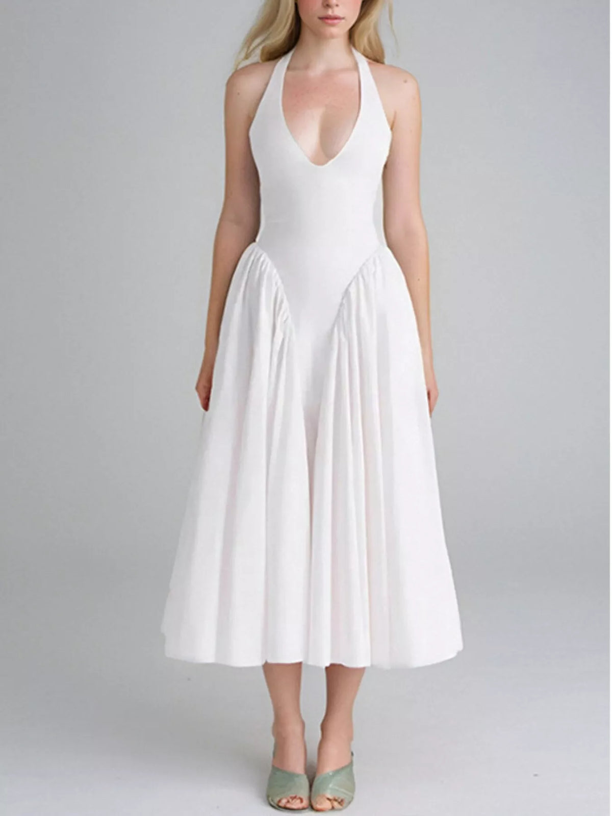 Halter neck midi dress with pockets on model
