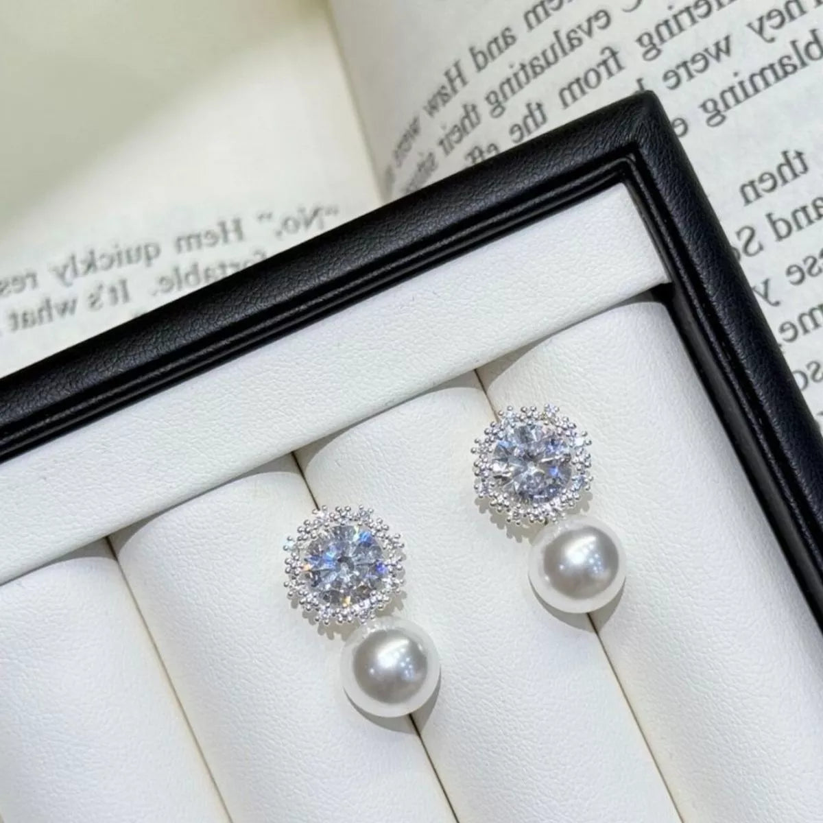Silver pearl drop earrings styled view