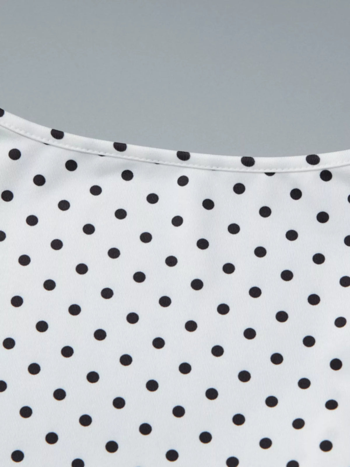 Full front view of the polka dot ruched top