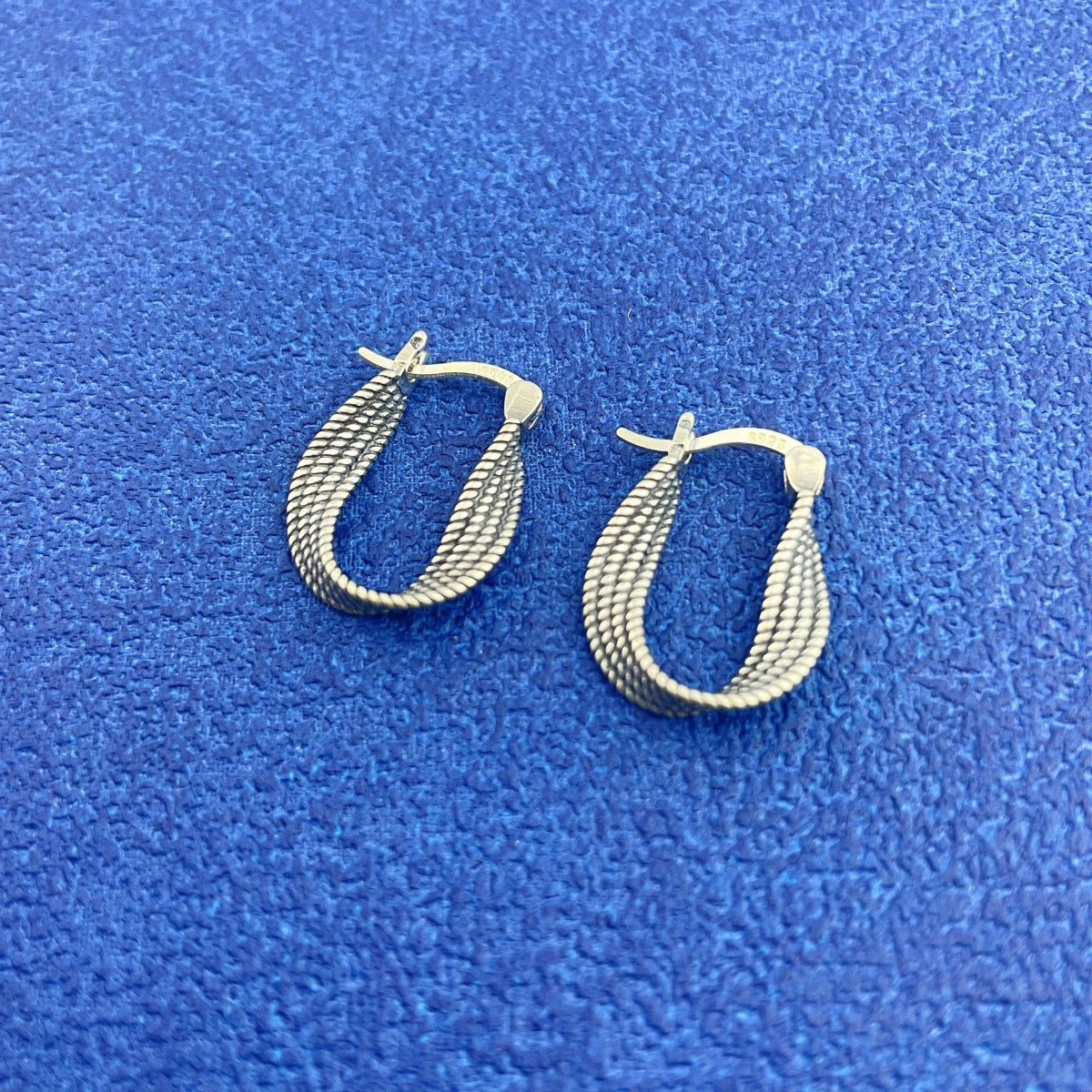 Sterling silver hoops side profile view
