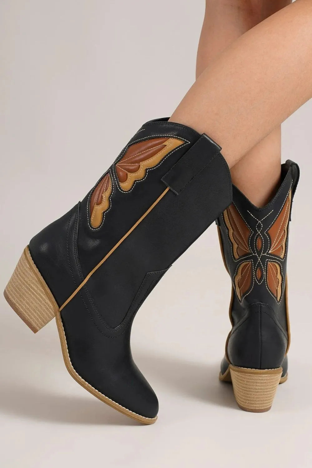 Butterfly cut out point toe boots front view