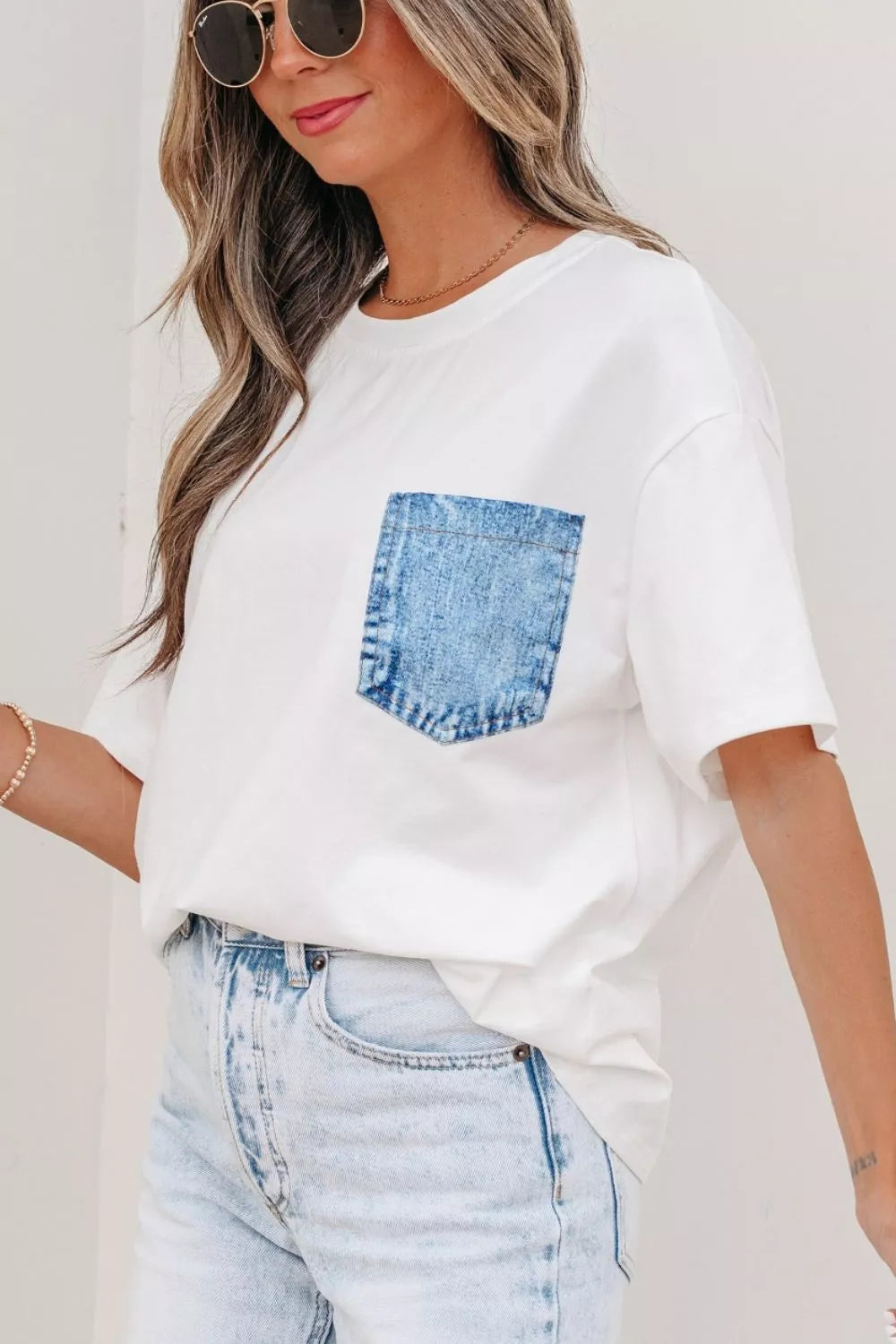White color block short sleeve top with chest pocket side view