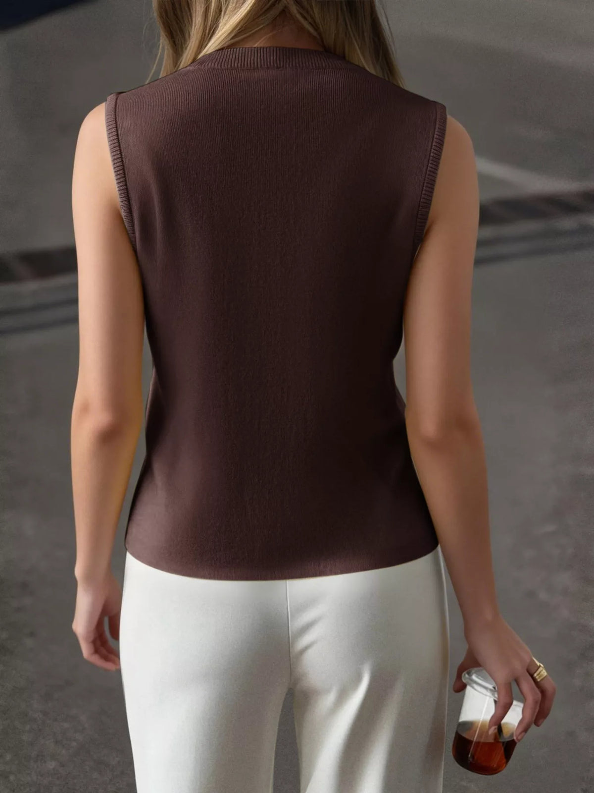 Knit vest styled over shirt
