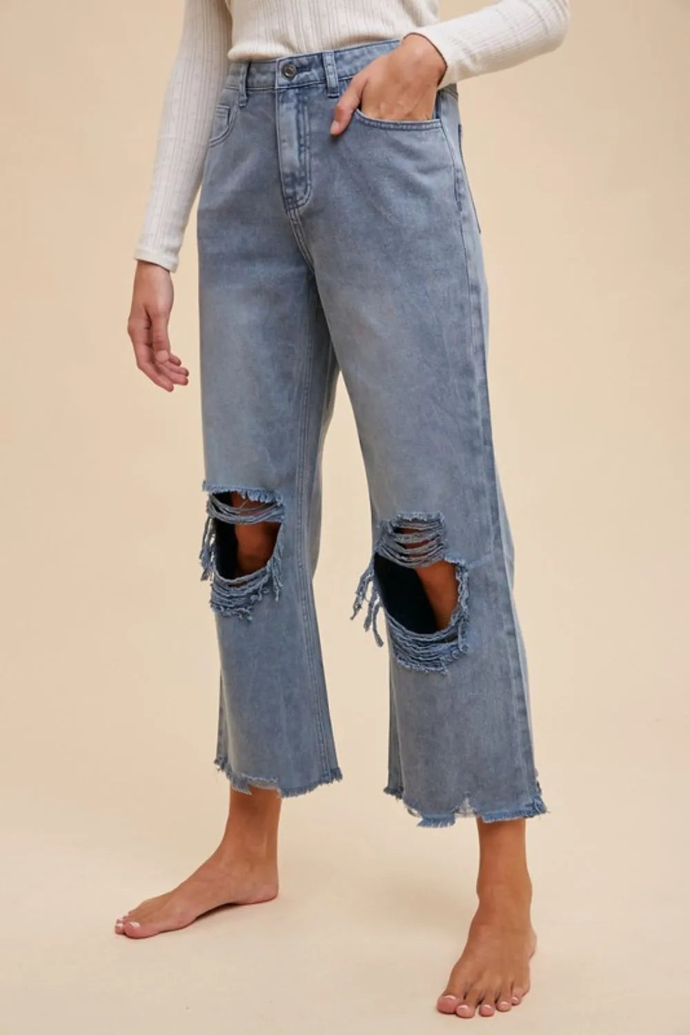 Dusty blue distressed denim detail