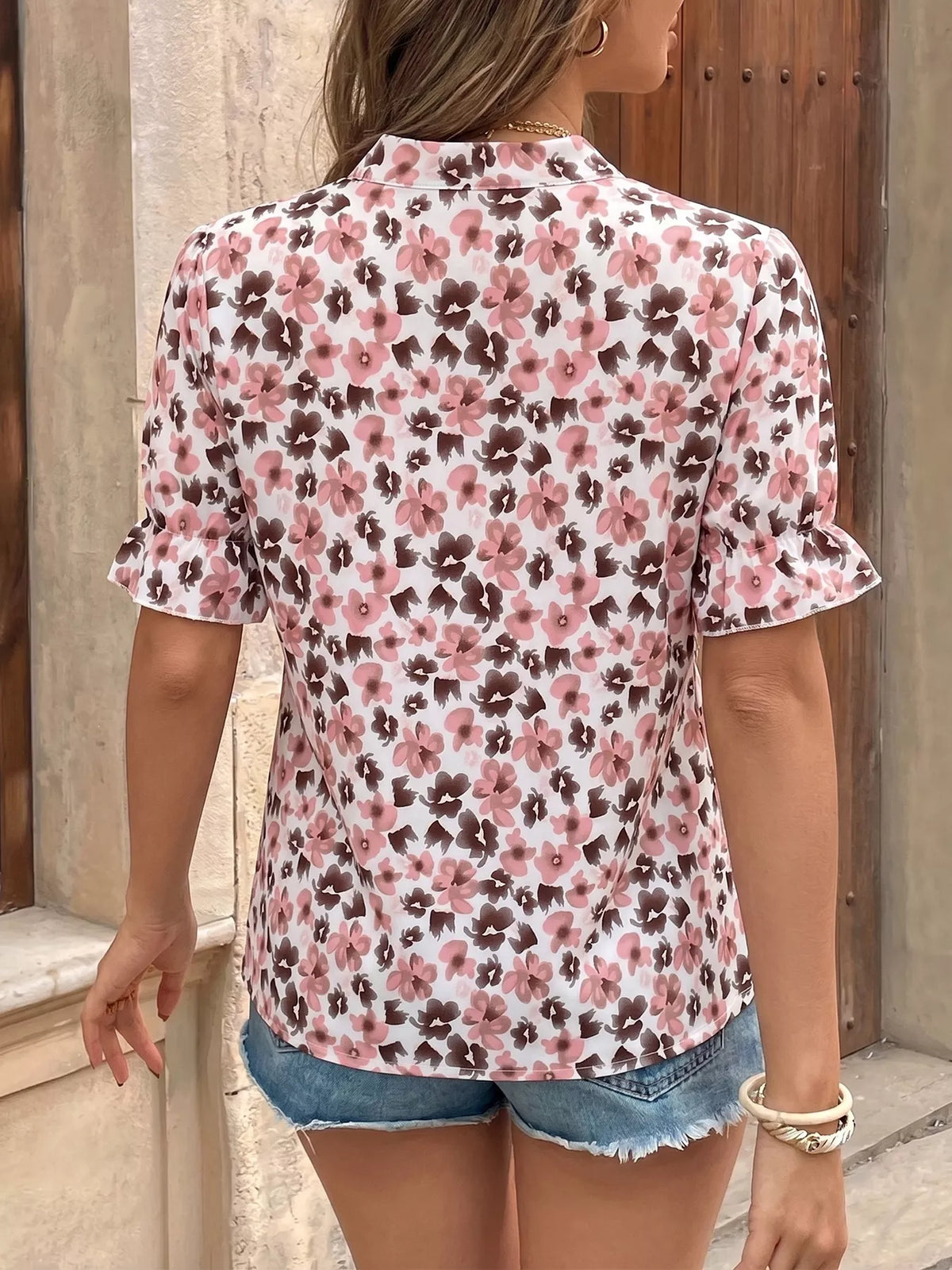 Pink floral tie neck ruffle blouse styled outfit view