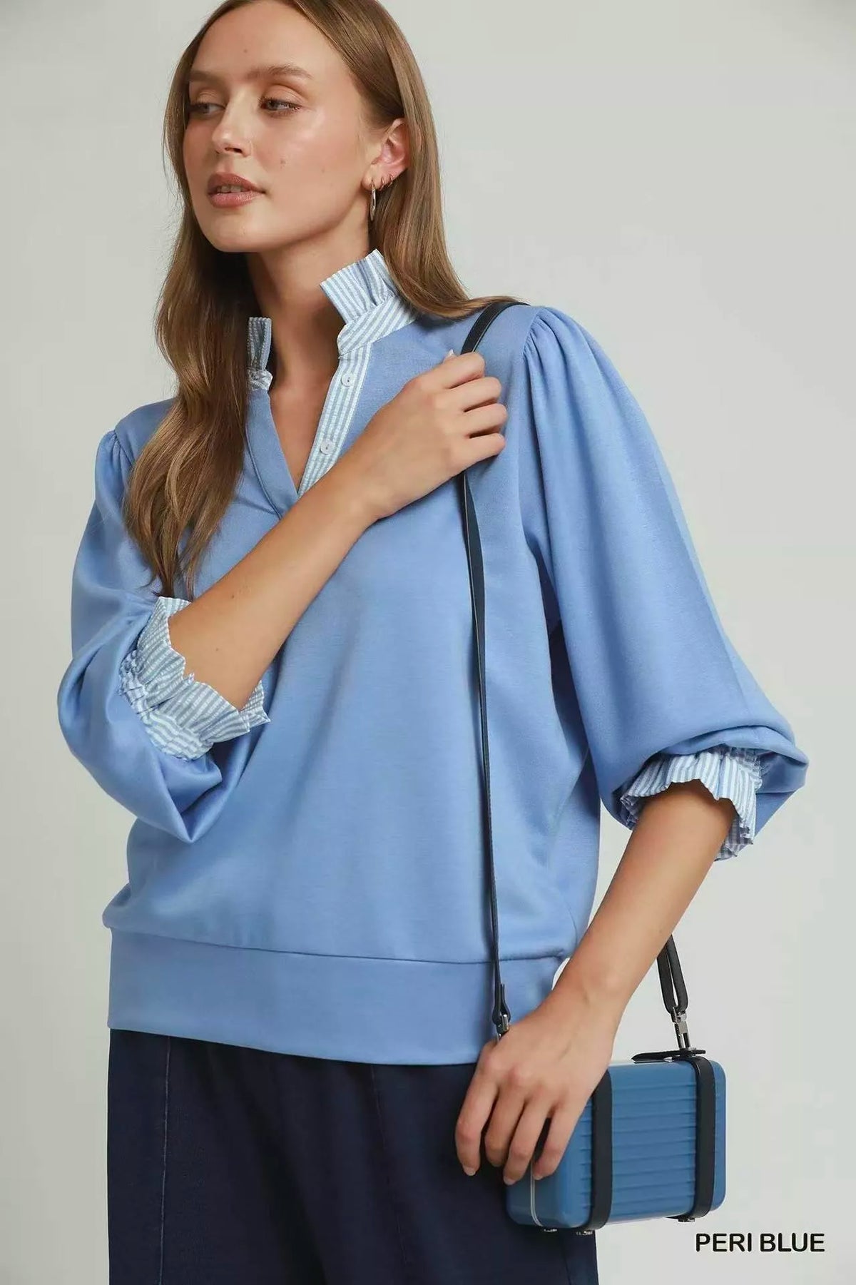 Umgee periwinkle blue striped ruffle neck top, back view