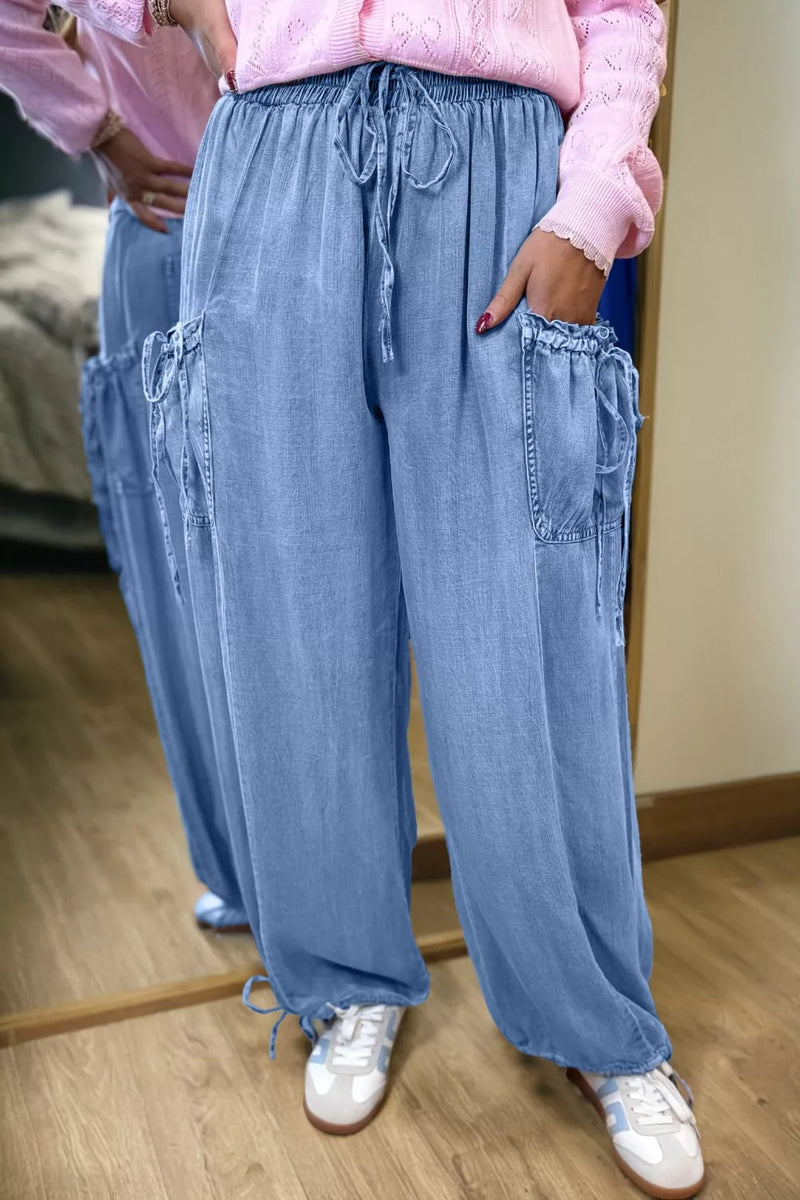 Drawstring elastic waist loose jeans in light blue front view