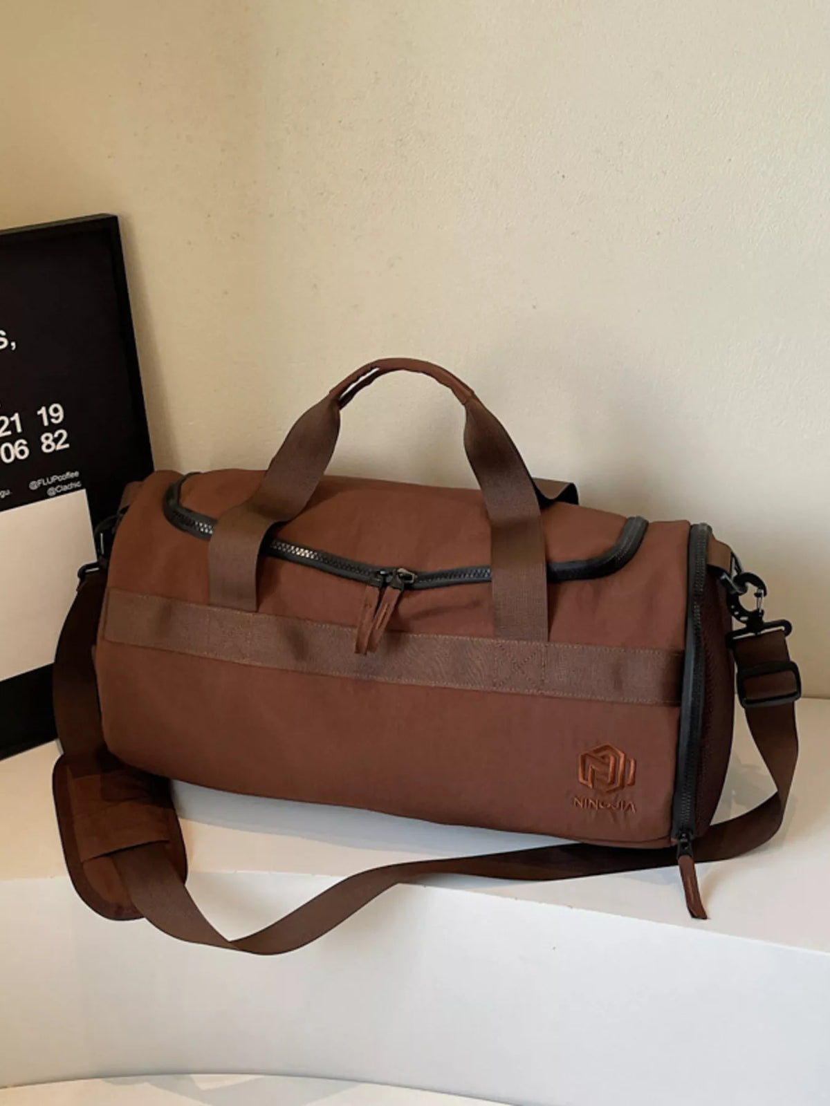 Brown duffel bag end pocket