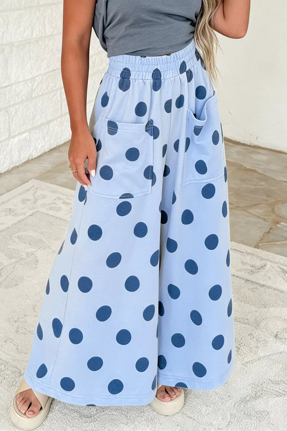 Front view of the wide leg pants showing the polka dot print