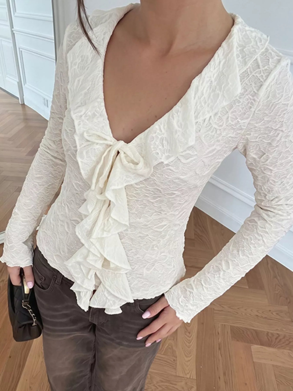 Ruffle detail on apricot long sleeve top
