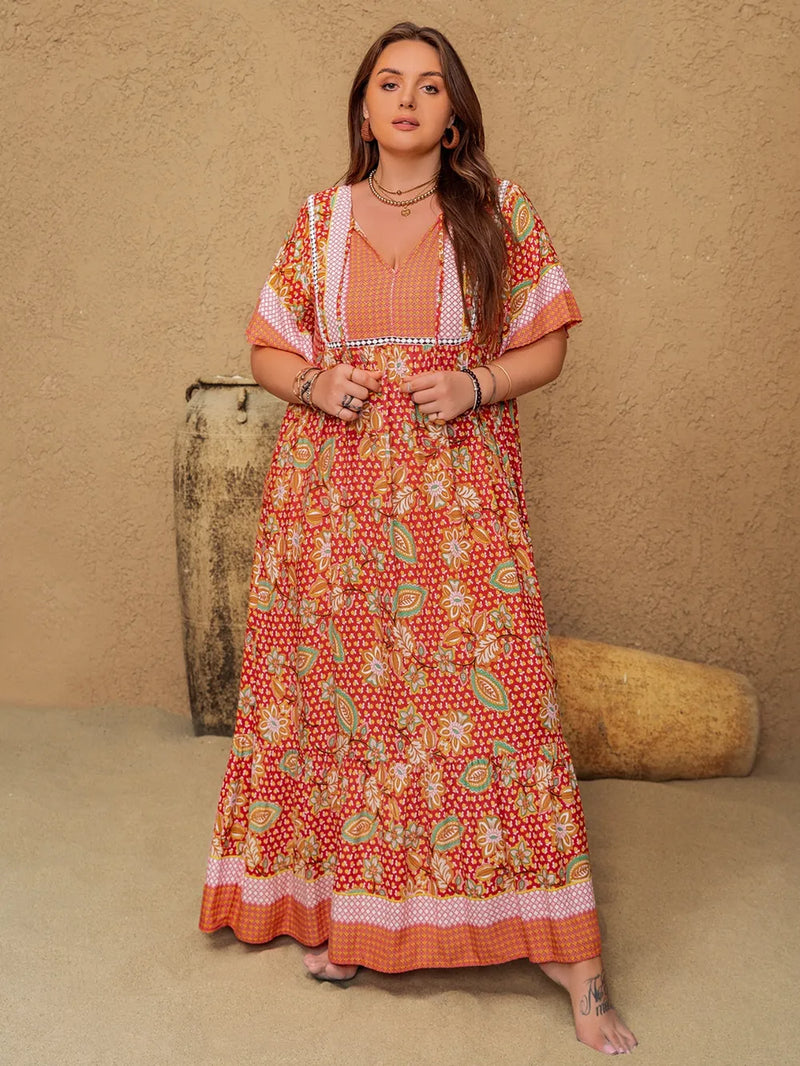 Plus size printed tie neck flutter sleeve maxi dress in coral front view