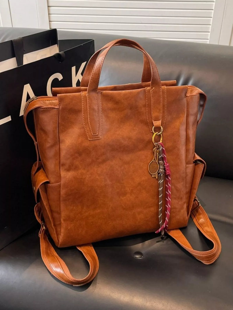 Terracotta vintage leather convertible backpack front view