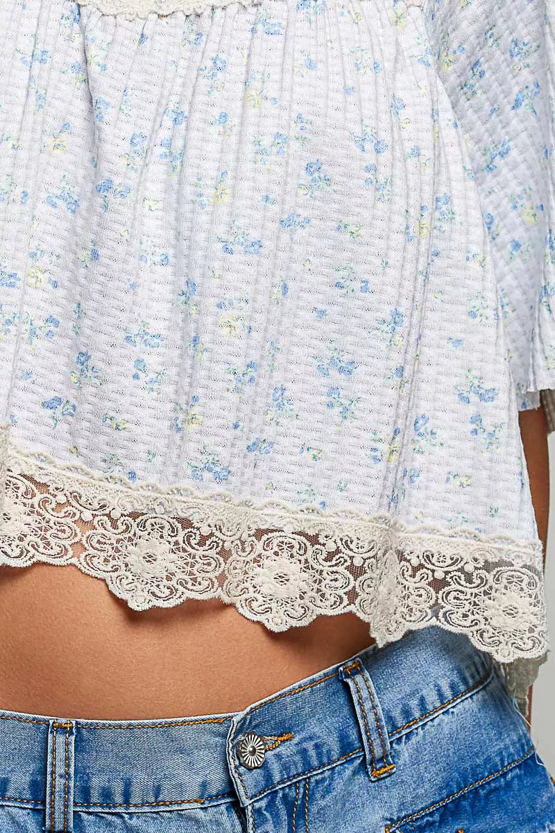 Lace trim blouse styled with denim jeans