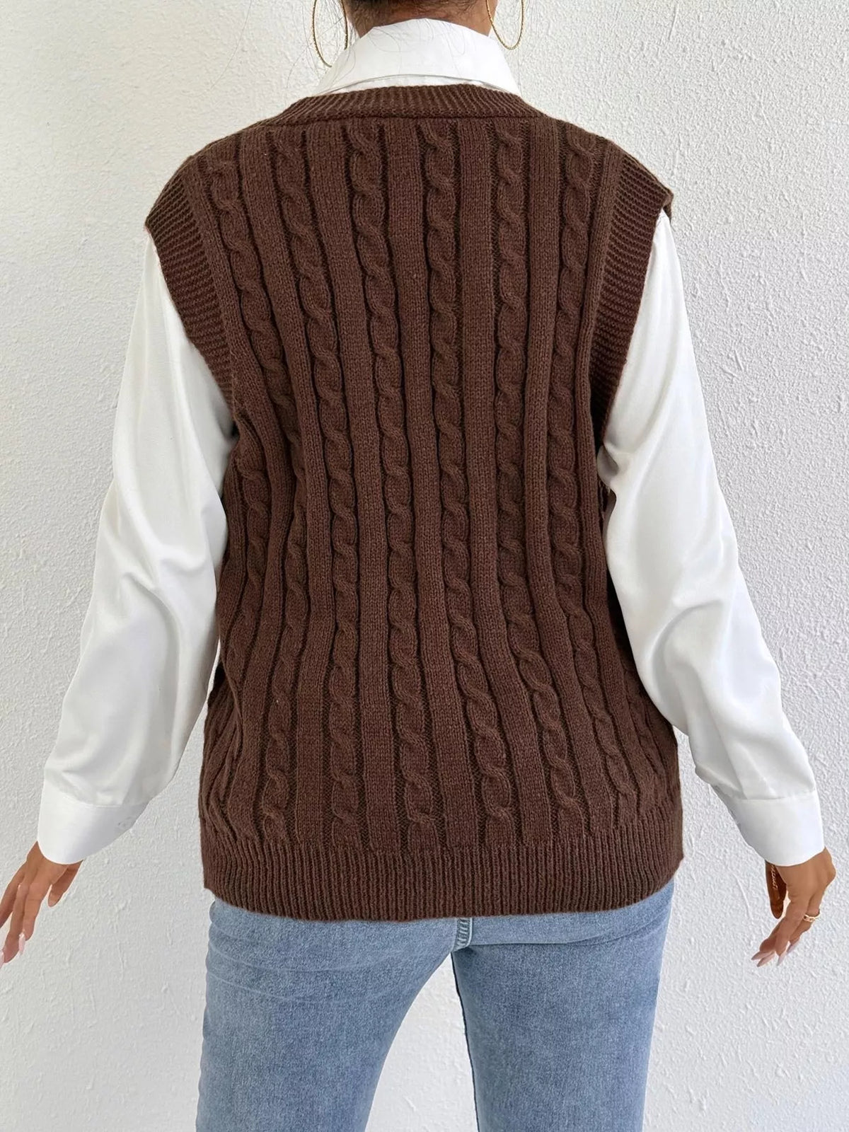 Cable knit button up sweater vest three quarter view
