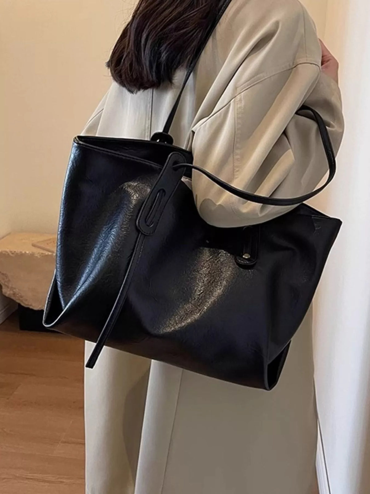 Back view of khaki shoulder bag