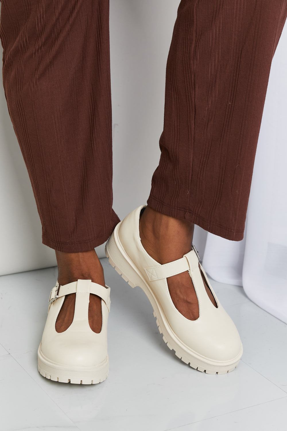Platform Mary Janes shown as a pair from the front