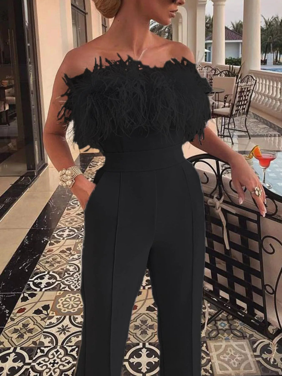 Wide leg silhouette of the feather trim jumpsuit, full length