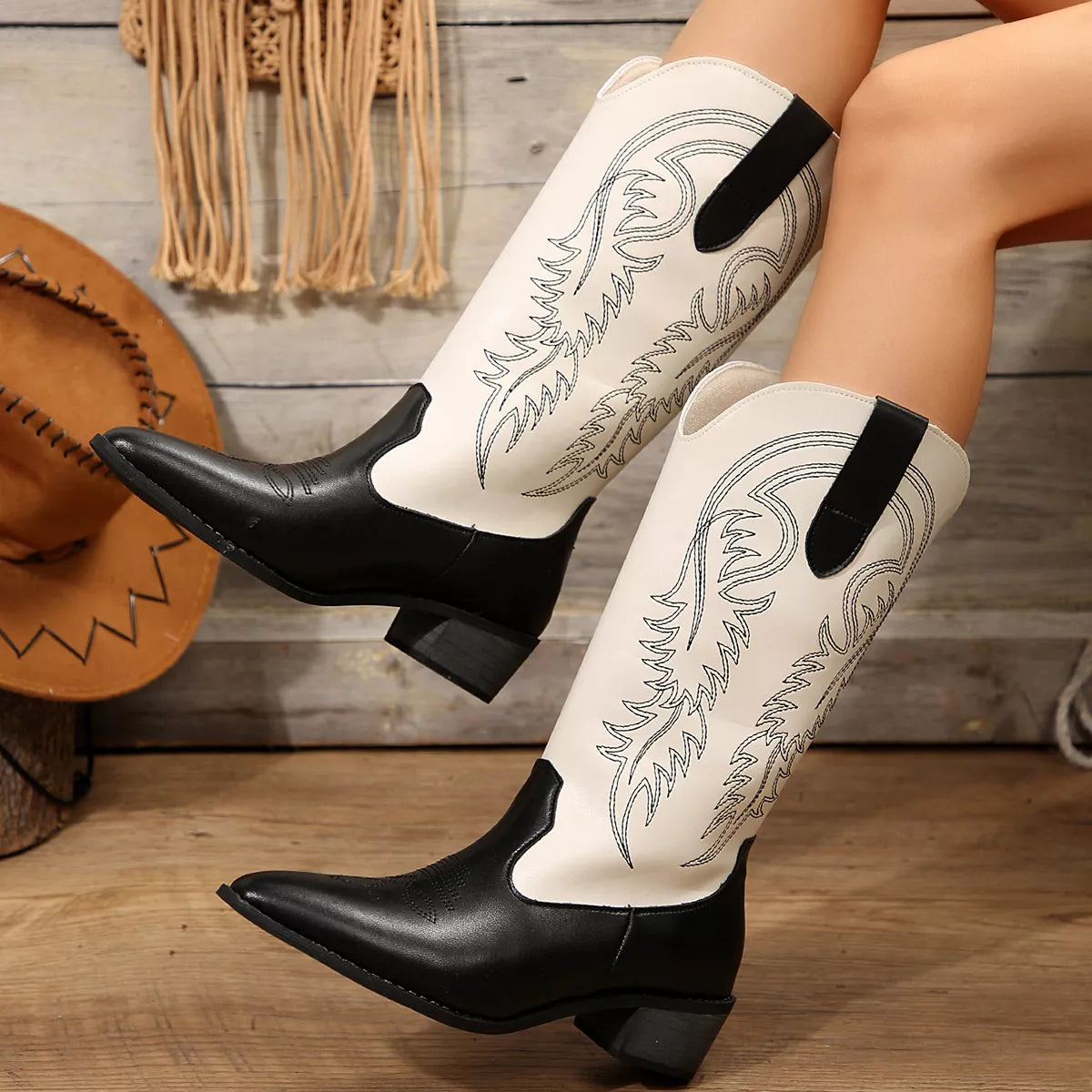 White block heel boots styled on model