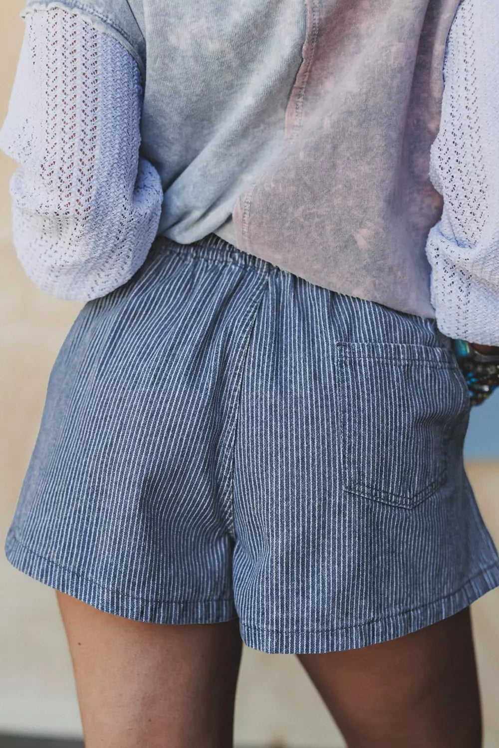 Dusty blue striped drawstring denim shorts side view