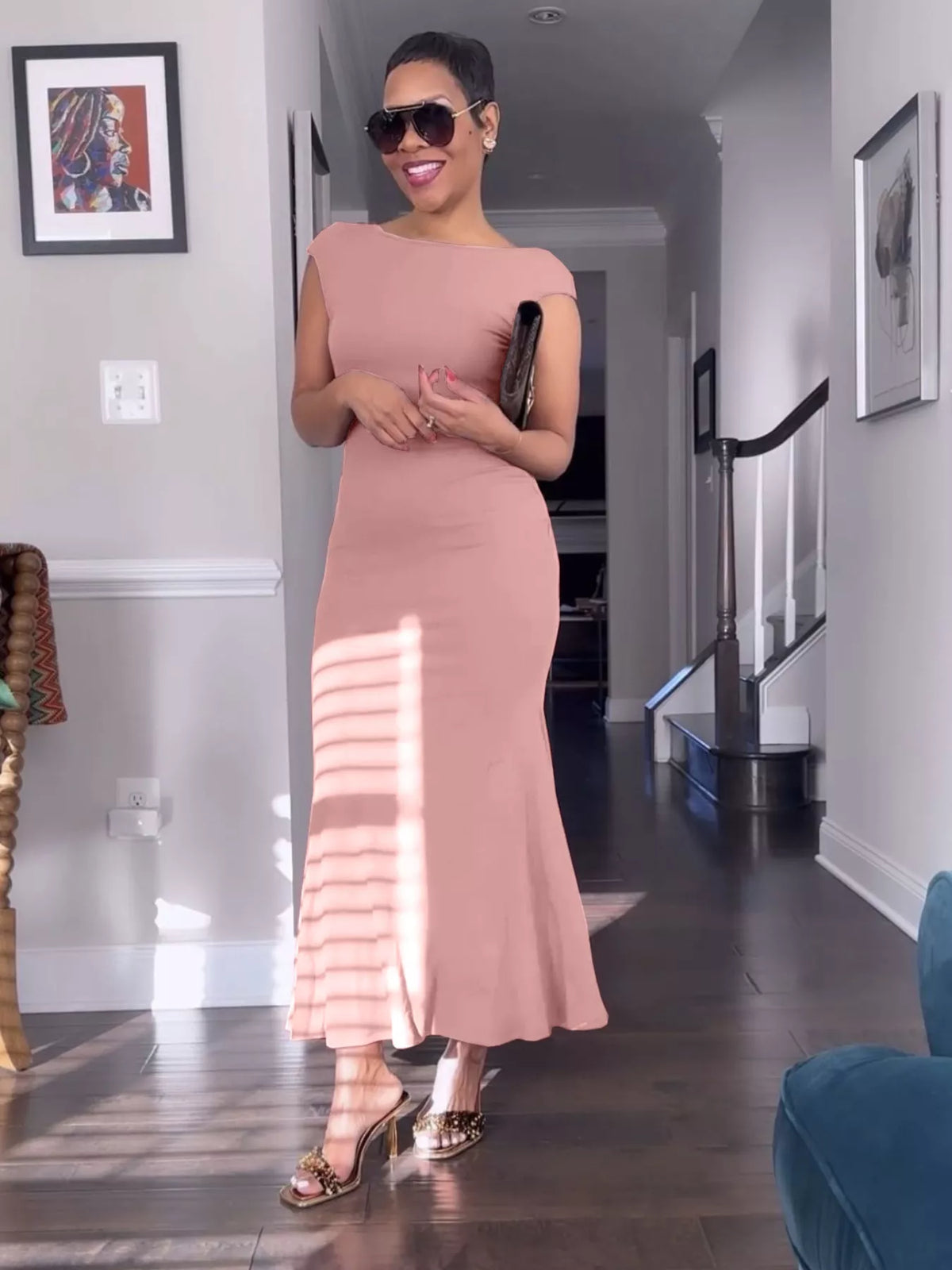 Side profile of the long backless maxi dress