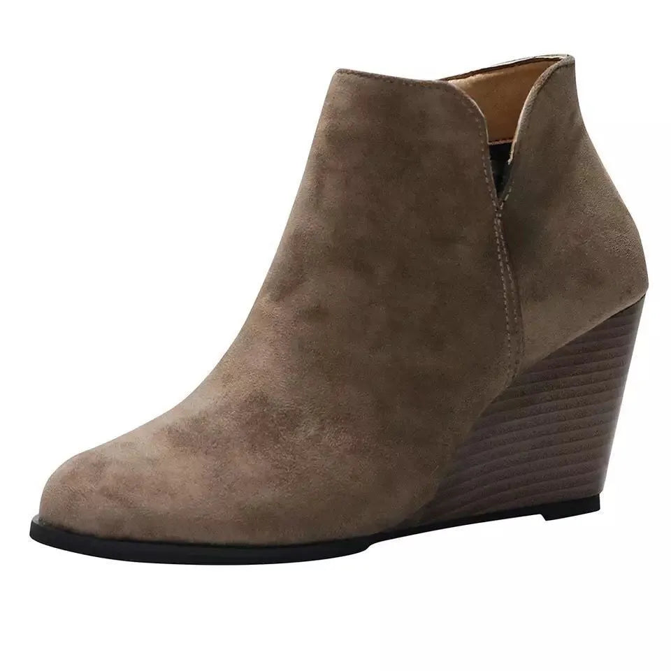 Khaki high heel ankle boots with side zip styled with denim