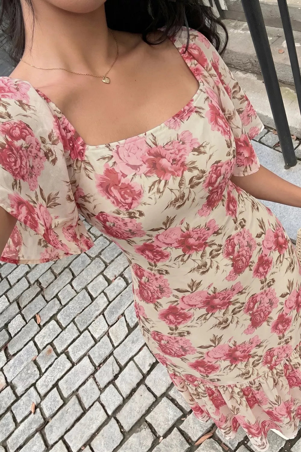 Floral print ruffle hem dress detail view