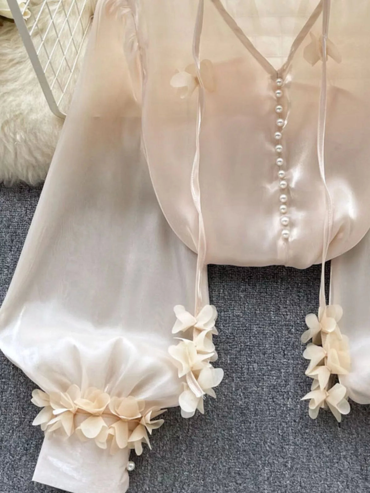 Back view of the sheer floral embellished shirt