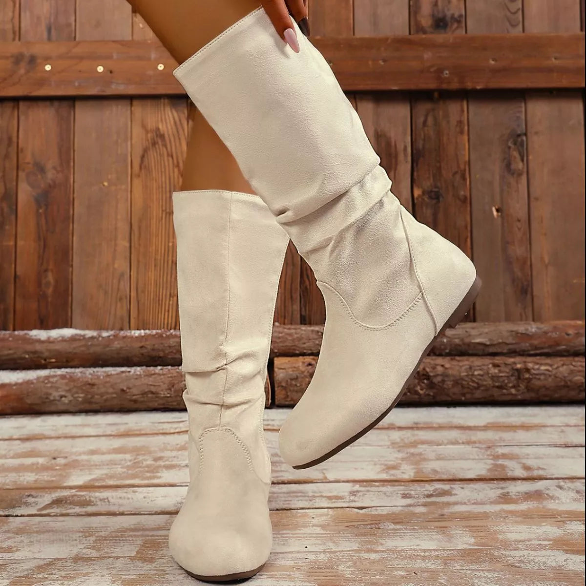 Round toe side zip boots worn with denim