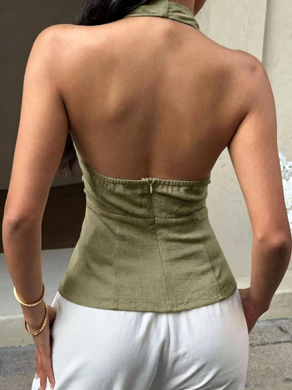 Moss green halter neck buckle tank detail of the fabric