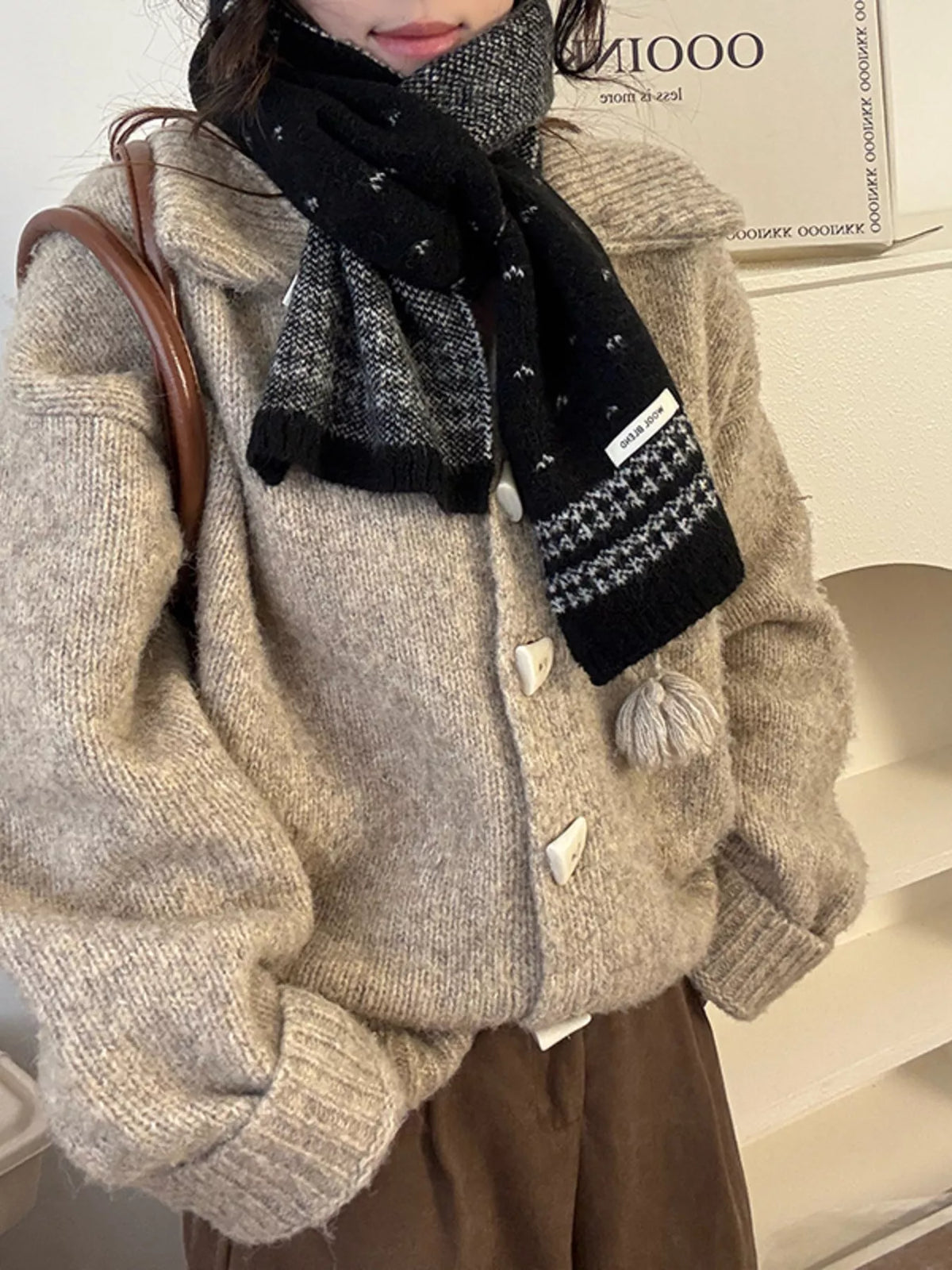 Winter knitted scarf styled with a cozy winter coat