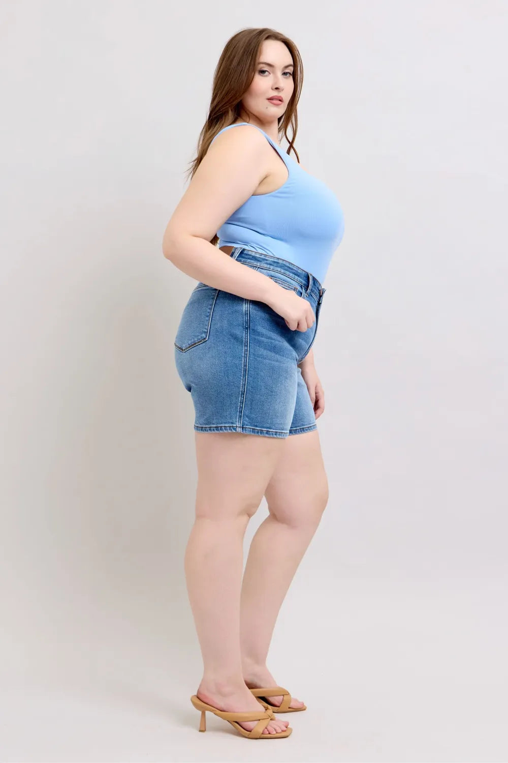 Denim shorts styled with a casual top