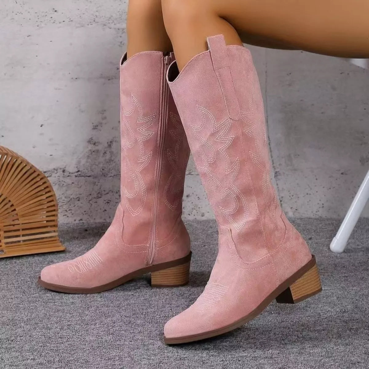 Suede point toe block heel boots studio flat lay
