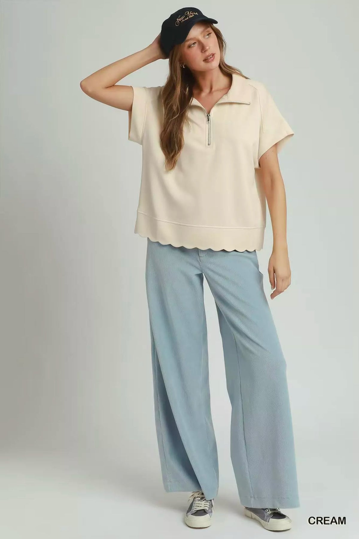 Cream Umgee half zip scalloped hem pullover styling detail