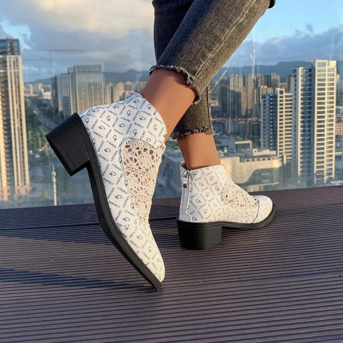 Printed Point Toe Block Heel Boots pair styled together