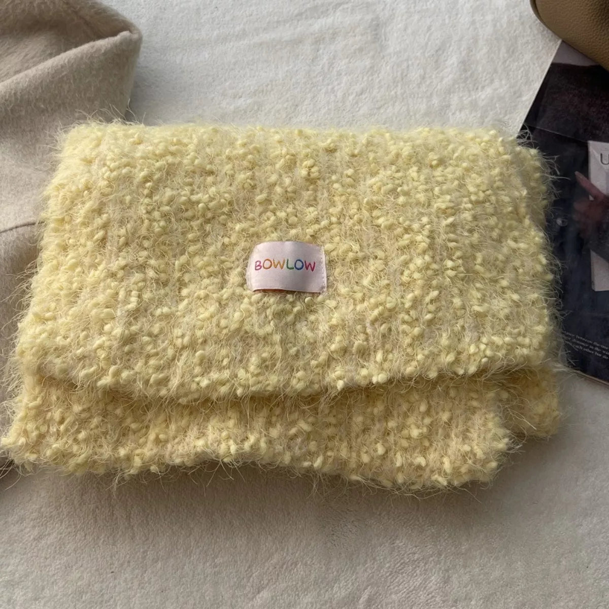 Plush winter scarf styled with a warm coat