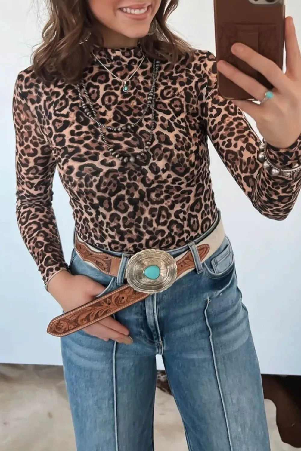 Close up of the high neckline on the leopard print top