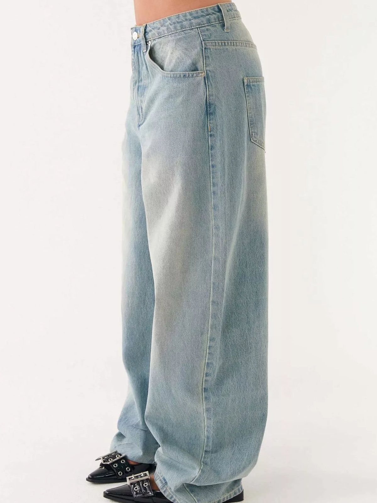 Denim jacket and jeans set styled with boots