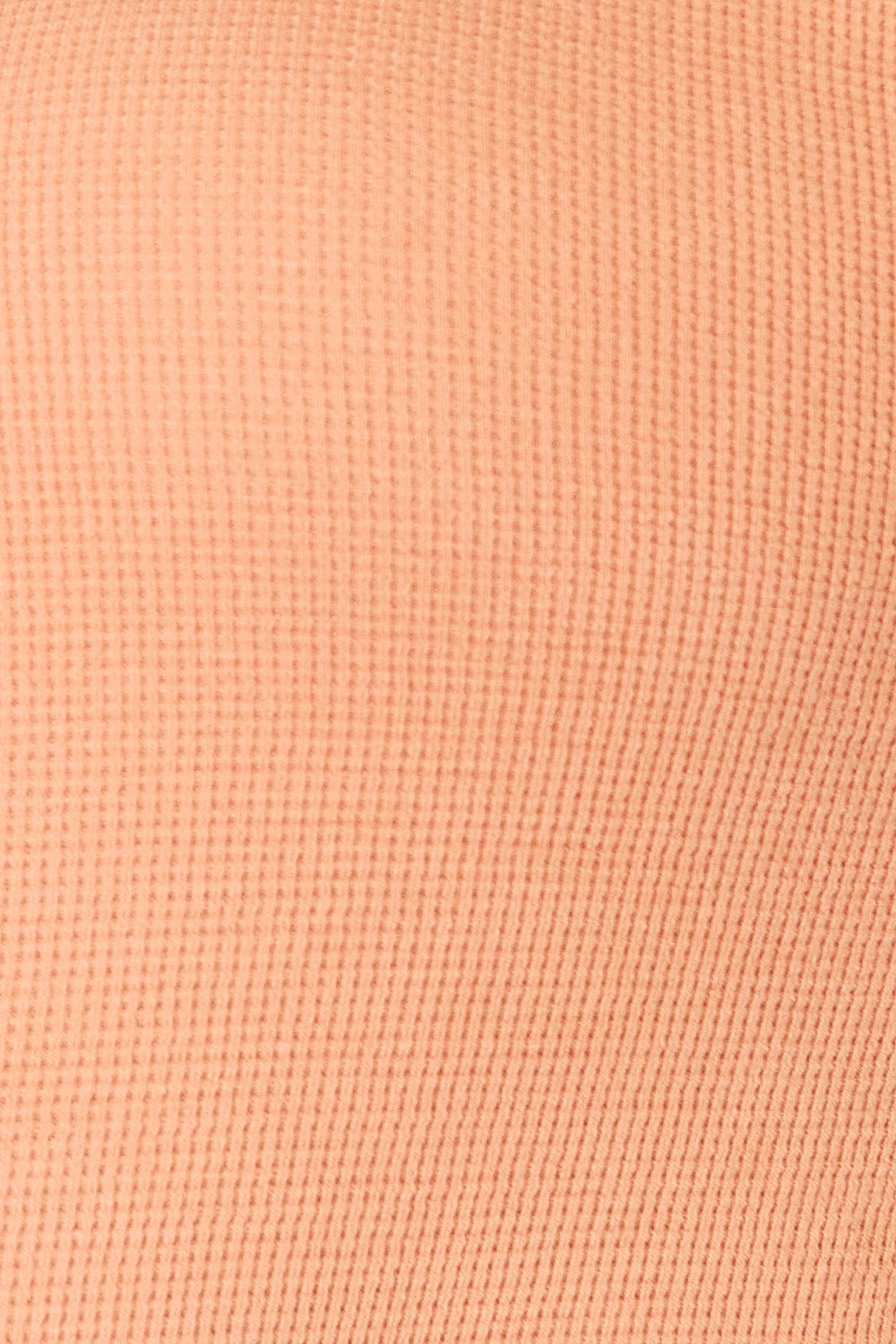 Fabric texture detail of the cotton blend top