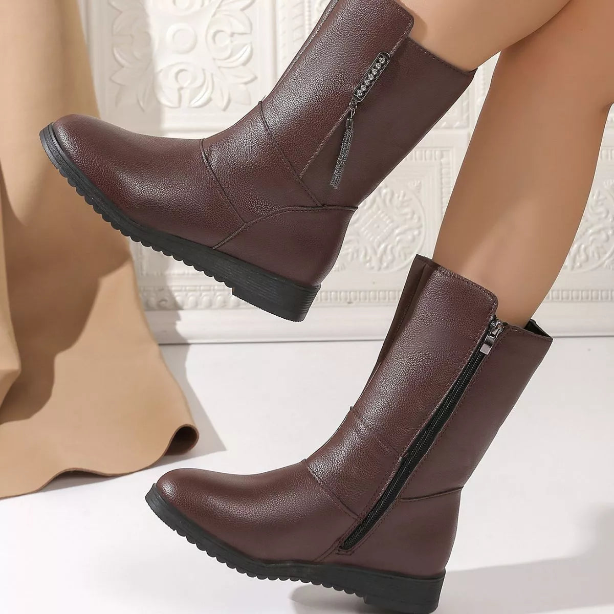 black round toe side zip boots angled pair view