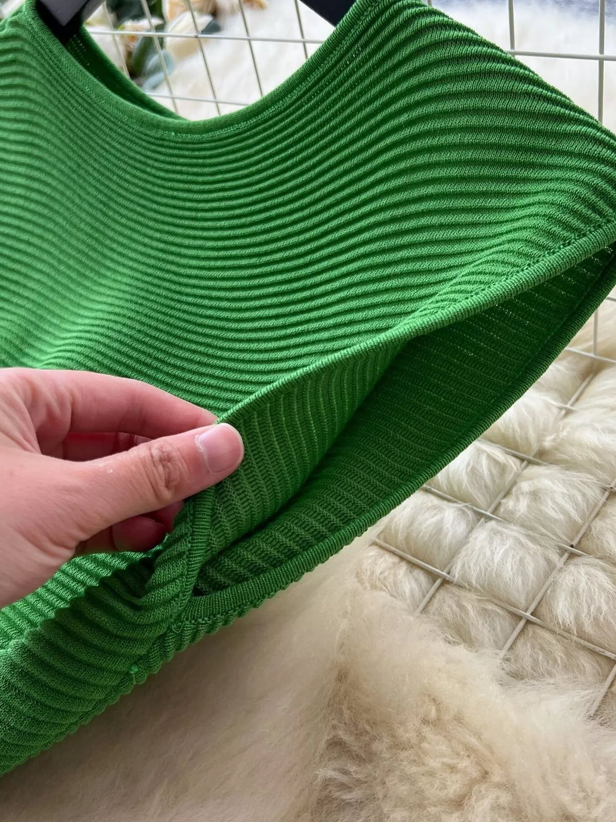Green sleeveless knit dress back view