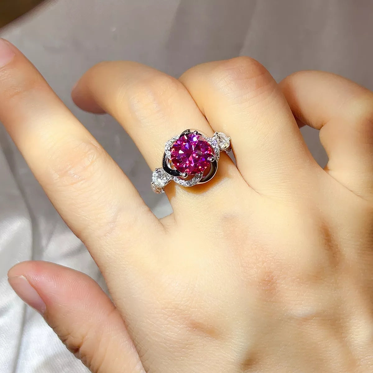 Starglow moissanite silver ring with a hot pink stone