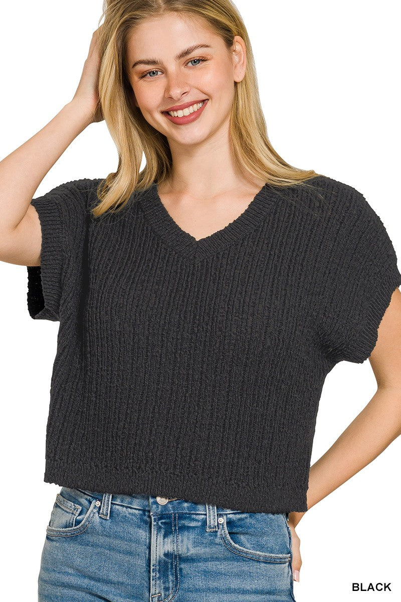 Black cropped sweater neckline detail
