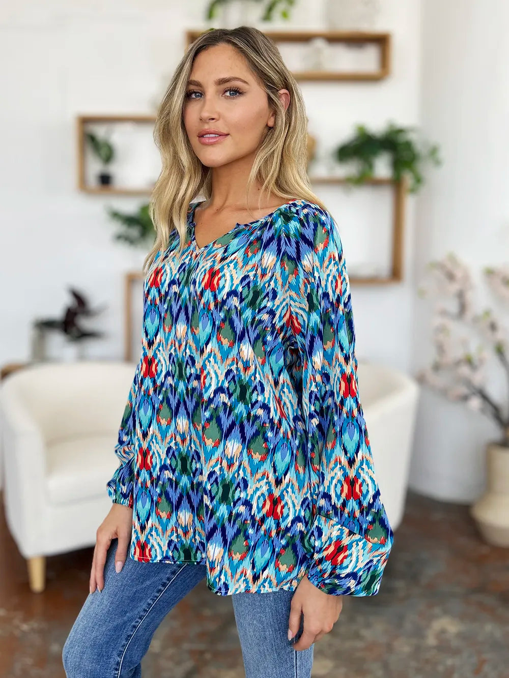 Blouse shown untucked over jeans