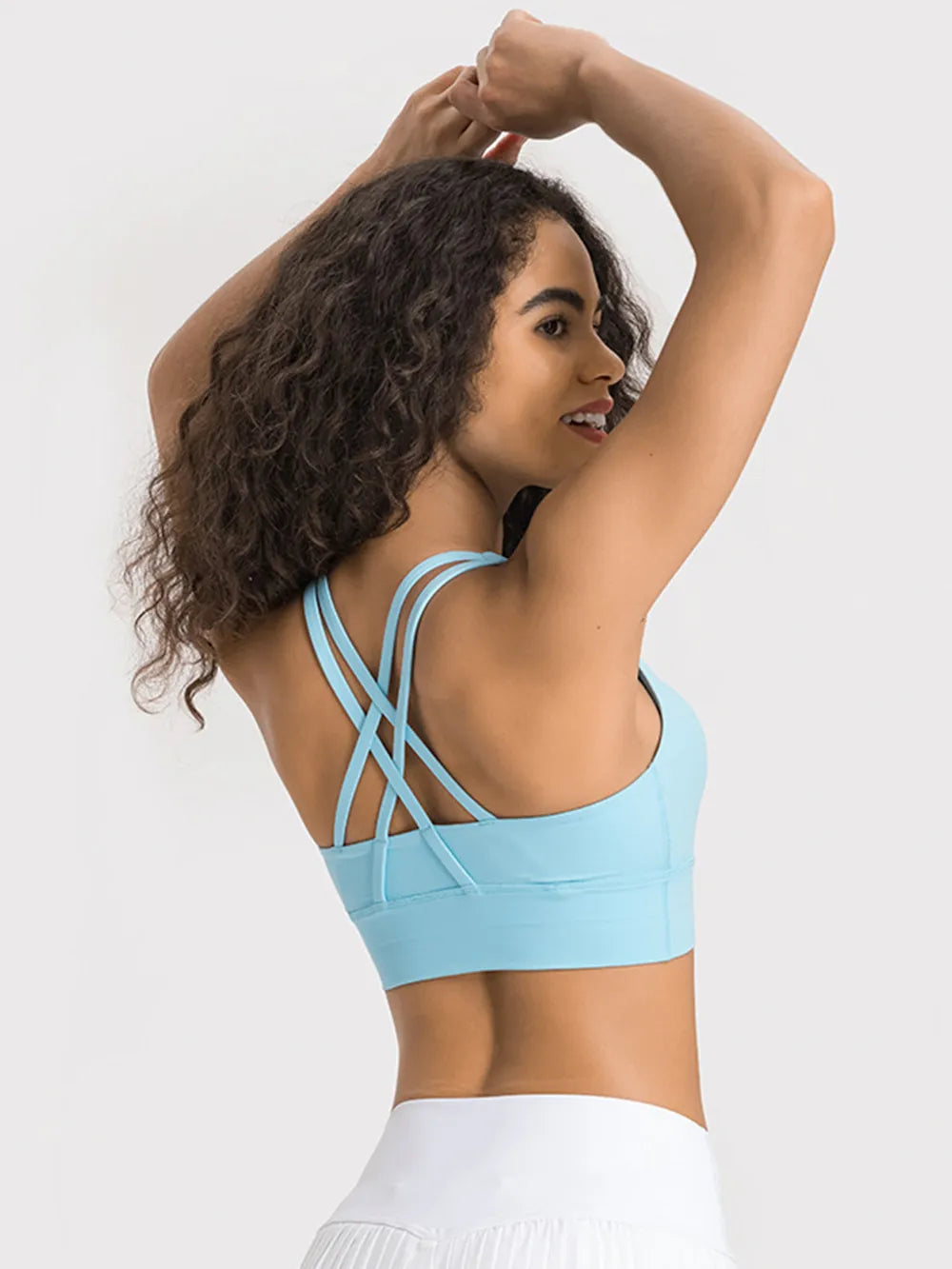 Crisscross scoop neck active tank three quarter view