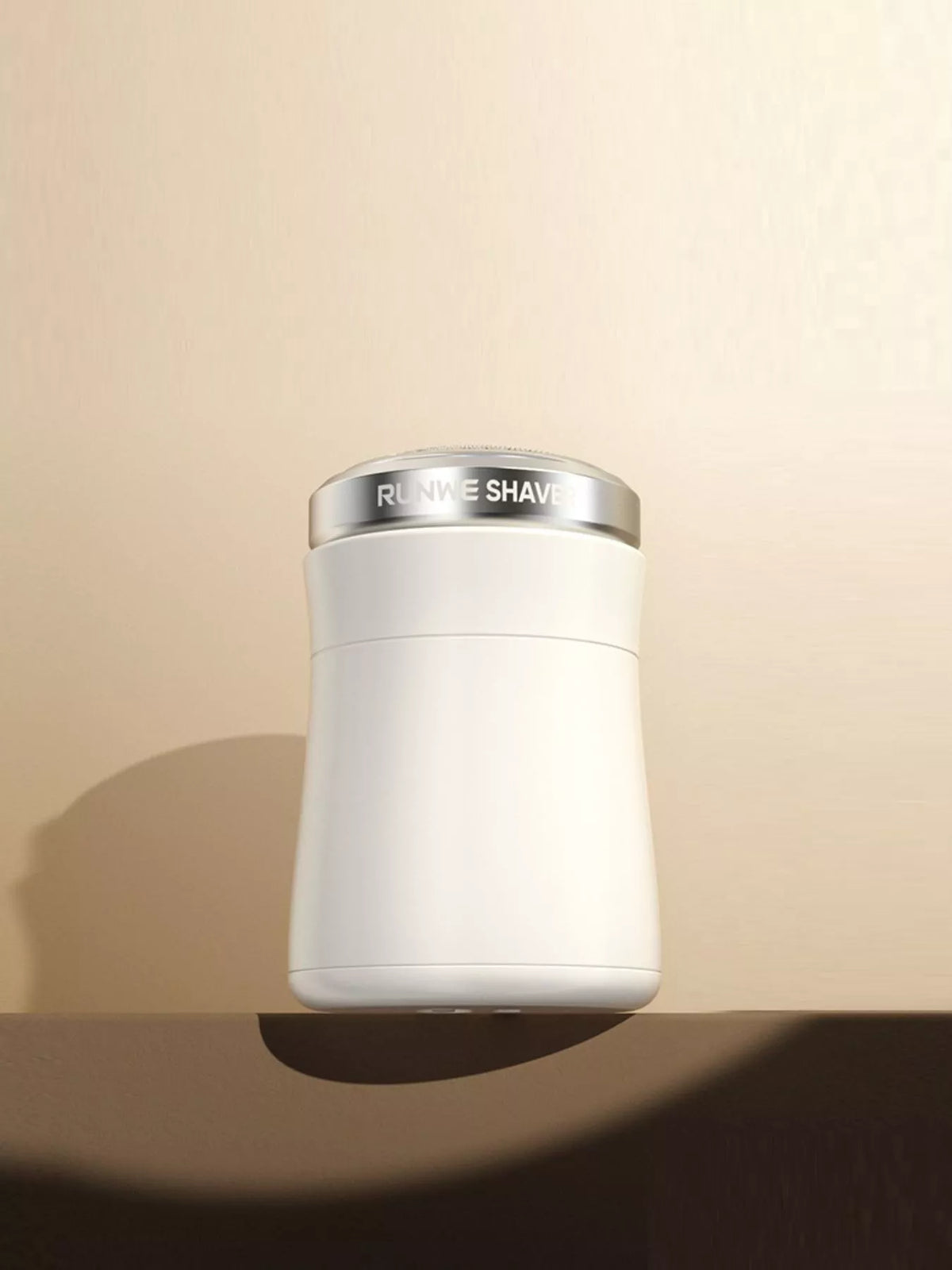 Portable shaver held in hand