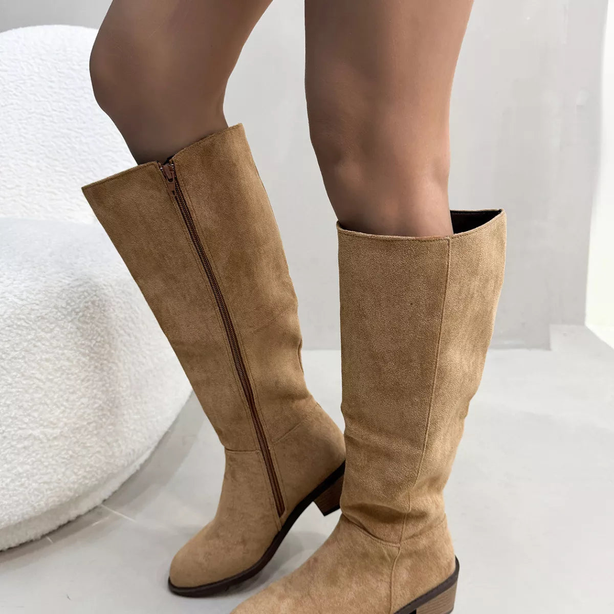 Khaki round toe block heels boots pair standing together