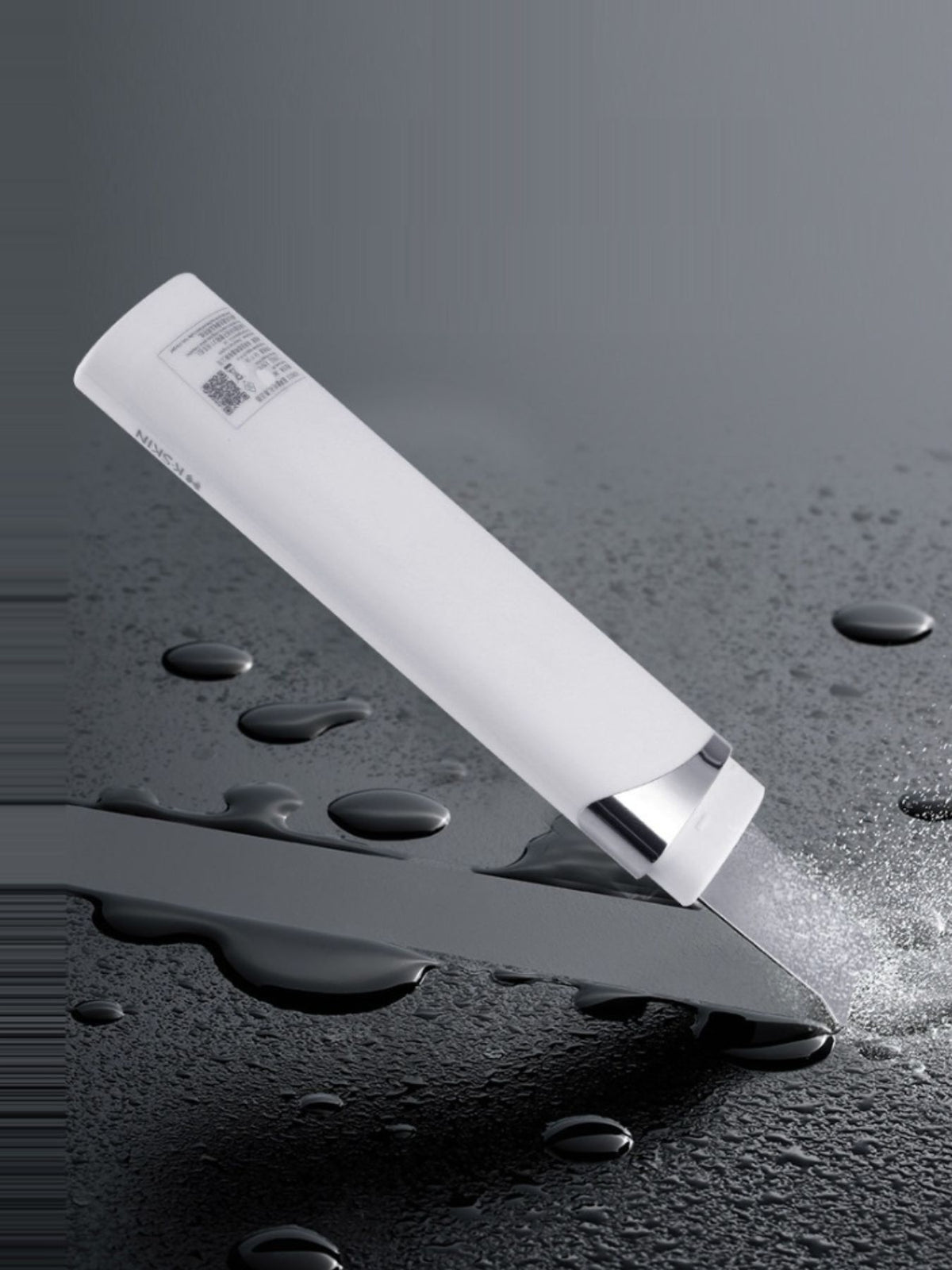 Blackhead extractor held in hand